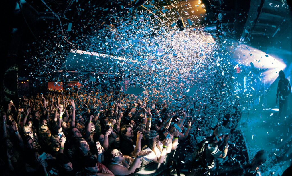 Crowd celebrating at a Bartour Hamburg event with confetti